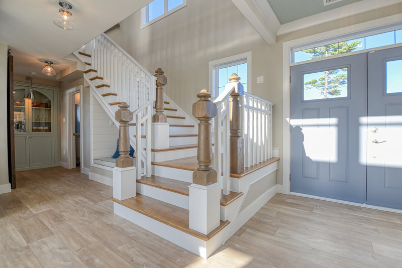 Entry way next to custom stairs 