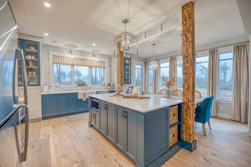 Kitchen / Dining area with custom kitchen island surrounded by century old wood posts